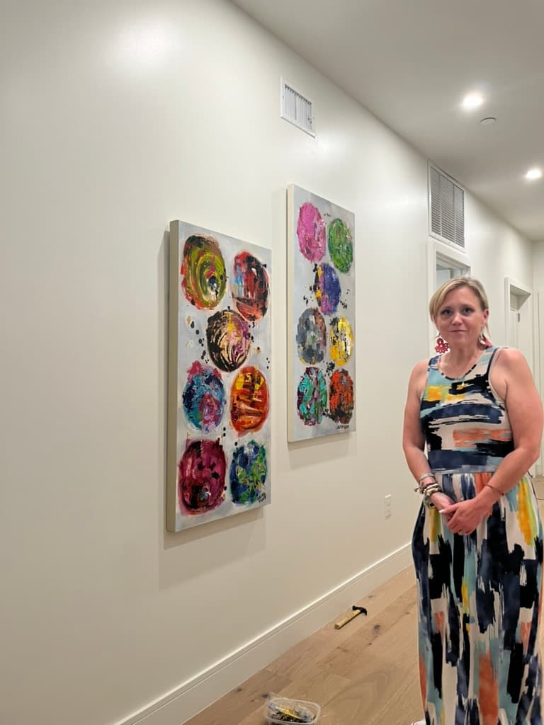 Artist standing with the installation