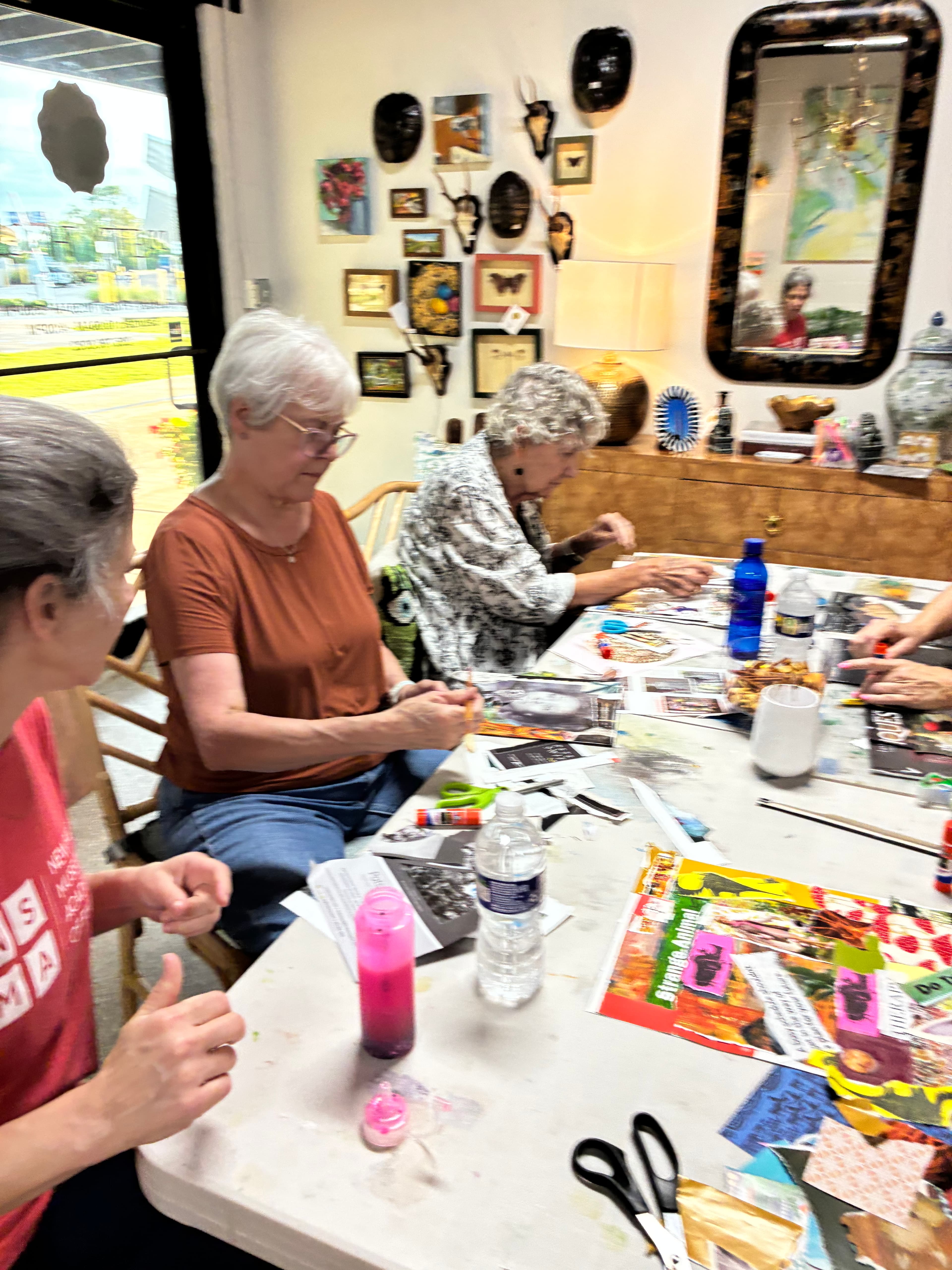 Guests working around the collage table